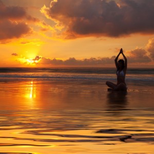 Woman in water sunset